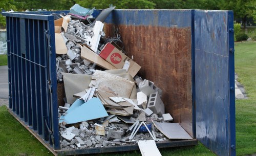 Builders clearing construction waste in Potters Bar